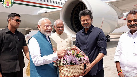 Tamil Nadu Chief Minister C. Joseph Vijay welcomes Prime Minister Narendra Modi upon his arrival in Chennai.