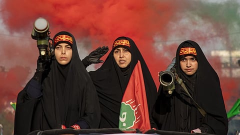 Women take a selfie at the Islamic Revolutionary Guard Corps (IRGC) Aerospace Force Museum in Tehran, Iran, November 12, 2025 