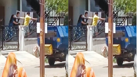 Gun pointed at worker over garbage mixing