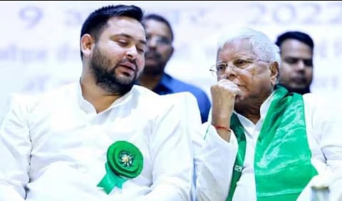 ex-railway minister Lalu Prasad(R), his son Tejashwi Yadav (L)