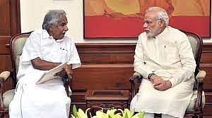 Prime Minister Narendra Modi with Former  Kerala chief minister Oommen Chandy 
