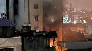More than a dozen people feared dead in a massive fire at an apartment building in Hanoi 