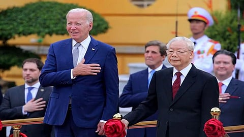 Vietnamese Gen Sec of the Communist Party Nguyen Phu Trong (R) and U.S. President Joe Biden (L), attend a military welcome ceremony at the Presidential Palace in Hanoi, Vietnam