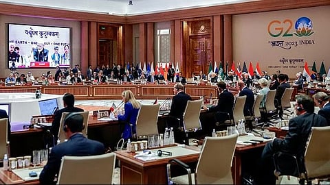 PM Narendra Modi appears on a screen as he attends "Session II: One Family" at the G20 summit in New Delhi