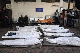 Gaza families search for bodies buried in rubble as Israeli missile strikes devastate the region