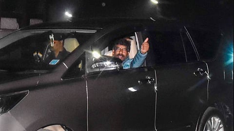 Hemant Soren gestures as he leaves from his residence for Raj Bhavan, in Ranchi.