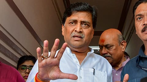 Ashok Chavan addresses the media outside his residence, at Churchgate in Mumbai.