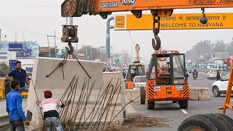 Road blocks being placed at Singhu Border ahead of the scheduled march by the protesting farmers in New Delhi.