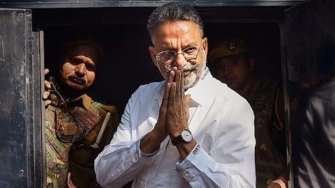 In this Dec. 28, 2022 file photo, gangster-turned-politician Mukhtar Ansari being produced at district court, in Prayagraj. 