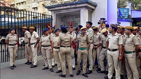 Security personnel stand guard outside Bhavani Bhawan (West Bengal Police headquarters) where CBI officials arrived to take Trinamool Congress leader Sheikh Shahjahan, accused in the Sandeshkhali case, in Kolkata, Wednesday, March 6, 2024. 