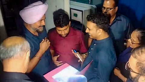 Enforcement Directorate (ED) officials at the residence of Delhi Chief Minister Arvind Kejriwal after the high court refused to grant him protection from coercive action in an excise policy-linked money laundering case, in New Delhi, Thursday, March 21, 2024. 