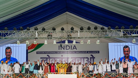 Leaders join hands during I.N.D.I.A. bloc's 'Loktantra Bachao Rally' at Ramleela Maidan, in New Delhi, Sunday, March 31, 2024.