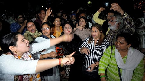 AAP supporters stage a protest outside the residence of Delhi Chief Minister Arvind Kejriwal in New Delhi, Thursday, March 21, 2024. Kejriwal was Thursday evening arrested by the Enforcement Directorate in an excise policy-linked money laundering case. 