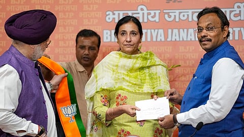 Union Minister and BJP leader Hardeep Singh Puri and BJP National General Secretary Vinod Tawde welcome IAS Parampal Kaur as she joins BJP, in New Delhi, Thursday, April 11, 2024. 