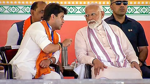 Prime Minister Narendra Modi with Union Minister and BJP leader Jyotiraditya Scindia during a public meeting for Lok Sabha elections, in Morena, Madhya Pradesh, Thursday, April 25, 2024. 