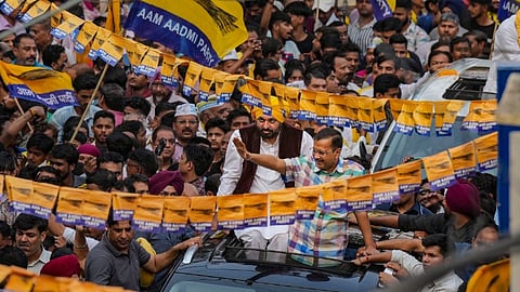 Delhi Chief Minister and AAP convenor Arvind Kejriwal with Punjab Chief Minister Bhagwant Mann during a road show for Lok Sabha elections, at Moti Nagar in New Delhi, Sunday, May 12, 2024.