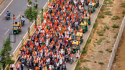 BJP supporters take part in a bike rally as part of party campaign for Lok Sabha elections, in Ahmedabad, Sunday, May 5, 2024.