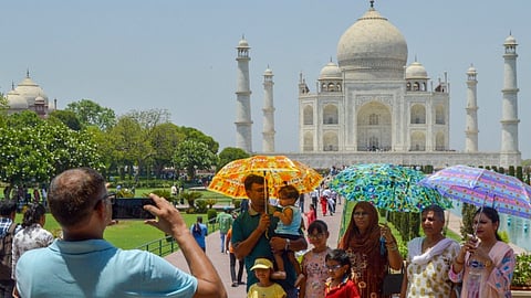 Tourists at the Taj Mahal on a hot summer day, in Agra, Sunday, May 26, 2024.