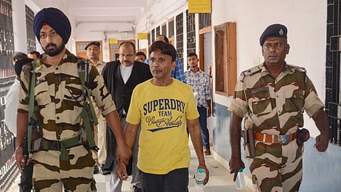 Jahangir Alam, domestic help of Jharkhand minister Alamgir Alam's secretary Sanjeev Kumar Lal, being produced before a court following his arrest after the Enforcement Directorate (ED) recovered 'unaccounted' cash during searches at his residence, in Ranchi, Tuesday, May 7, 2024. 