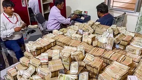 Officials of the Enforcement Directorate recover 'unaccounted' cash during searches at the premises of a domestic help allegedly linked to the secretary of Jharkhand minister Alamgir Alam, in Ranchi, Monday, May 6, 2024.