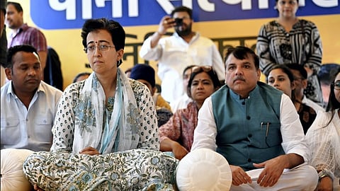 Delhi Water Minister Atishi with AAP MP Sanjay Singh and others during her indefinite fast over water crisis, in New Delhi, Saturday, June 22, 2024. 