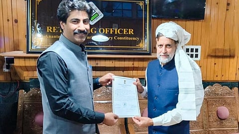 Son of jailed independent candidate from Baramulla constituency Sheikh Abdul Rashid alias Engineer Rashid receives certificate from the Returning Officer after Rashid won the Lok Sabha elections, in Baramulla district, Tuesday, June 4, 2024. 