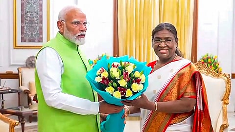President Droupadi Murmu greets Prime Minister Narendra Modi as he arrives to tender his resignation letter following the end of 17th Lok Sabha, at Rashtrapati Bhavan, in New Delhi, Wednesday, June 5, 2024. 