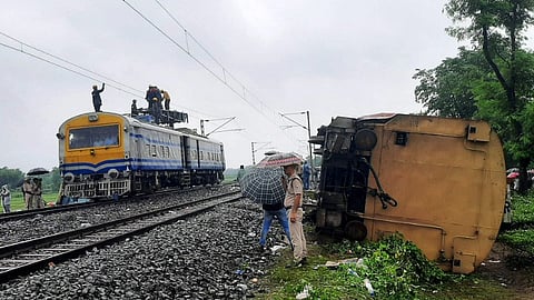 Restoration work underway near the accident site a day after the collision between the Kanchanjunga Express and a goods train, near Rangapani railway station, Tuesday, June 18, 2024. 
