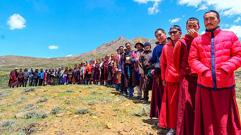 Voters wait in a queue to cast votes for the seventh and last phase of Lok Sabha polls at the world's highest polling station, in Tashigang, Lahaul and Spiti, Saturday, June 1, 2024. 