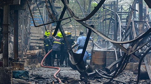 Firemen after dousing a fire that broke out at the closed chemical factory at Dombivli area, in Thane district, Wednesday, June 12, 2024.