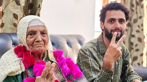 Mother and son of jailed independent candidate from Baramulla constituency Sheikh Abdul Rashid alias Engineer Rashid show victory sign after Rashid won the Lok Sabha elections, on Tuesday, June 4, 2024.