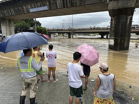 Taiwan prepares for a strong typhoon that worsened monsoon rains in the Philippines, killing 13