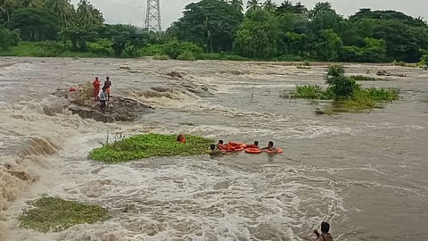 In a daring rescue effort, fire force personnel on Tuesday saved four people, including an elderly man and woman, who were stranded on a rock in the middle of the swollen Chittoor river in Palakkad district.