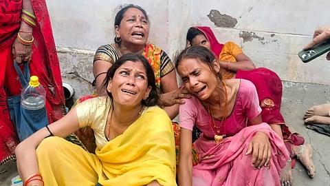 Relatives outside a Trauma Centre where victims of the Hathras' stampede are admitted, in Etah, Tuesday, July 2, 2024. 