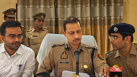 IG Aligarh Range Shalabh Mathura (M) along with DM Hathras Ashish Kumar (L) and Hathras SP Nipun Aggarwal (R) addresses a press conference regarding probe into the Hathras Stampede that claimed 121 lives on Tuesday, in Hathras district, Thursday, July 4, 2024. 