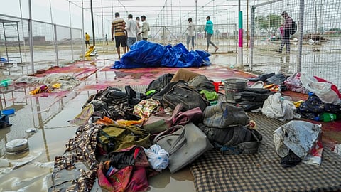 Bags and other belongings lying at the scene a day after a massive stampede that took place during a 'satsang' (religious congregation), in Sikandara Rao area in Hathras district, Wednesday, July 3, 2024. 