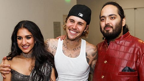 Singer Justin Bieber poses for a photo with Anant Ambani and his fianc� Radhika Merchant during pre-wedding festivities of the couple, in Mumbai. 