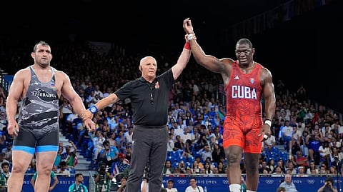 Cuba's Lopez, 41, wins semis to earn shot at record 5th Olympic gold in wrestling    