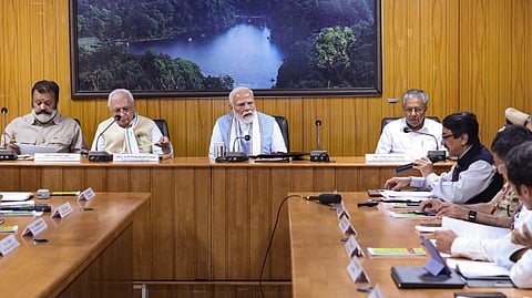Prime Minister Narendra Modi along with MoS Suresh Gopi, Kerala Governor Arif Mohammed Khan and Chief Minister Pinarayi Vijayan, holds a meeting to review the damages caused by recent landslides, in Wayanad district, Saturday, Aug. 10, 2024.
