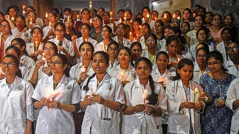 Junior Doctors of Gandhi Medical College take part in a candle light march in protest against rape and killing of a trinee doctor at Kolkata's R G Kar Medical College, in Hyderabad, Monday, Aug. 12, 2024.