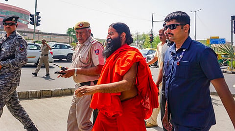 Patanjali Ayurved co-founder Baba Ramdev arrives to appear before the Supreme Court, in New Delhi, Tuesday, April 30, 2024.