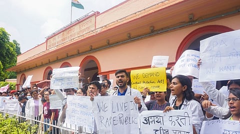 Doctors raise slogans during a protest against the alleged rape and murder of a trainee doctor at a hospital in Kolkata