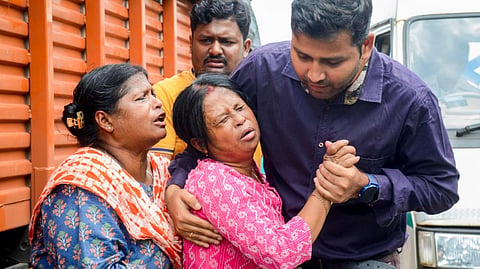 Relatives of Subhrodeep Dutta, trainee pilot of a missing aircraft, react emotionally after his body was recovered by rescue teams during the search operation, at a hospital in Seraikela-Kharswan district, Thursday, Aug. 22, 2024. 