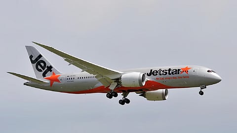 Passenger arrested at Australian airport after leaving parked airliner through emergency exit 