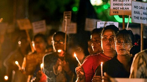 Women take part in a candlelight protest march against the alleged sexual assault and murder of a postgraduate trainee doctor in Kolkata, in Nagaon district of Assam, Saturday, Aug. 24, 2024.