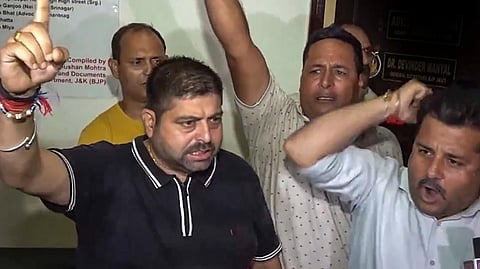 BJP workers protest after the party released the first list of candidates for the J&K Assembly election, in Jammu, Monday, Aug. 26, 2024.