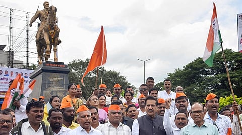 Former chief minister of Maharashtra Prithviraj Chavan with Congress workers protest against the collapse of Chhatrapati Shivaji Maharaj's statue, in Karad, Tuesday, Tuesday, Aug. 27, 2024.
