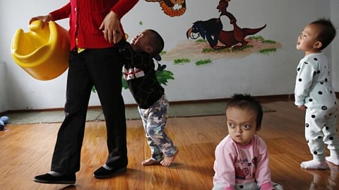 China halts foreign adoptions of its children