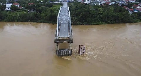 Bridge collapses as more rain falls in Vietnam & storm deaths rise to 21   