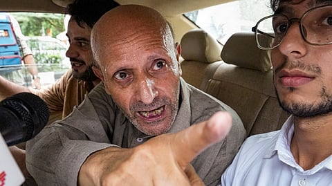 Baramulla MP Sheikh Abdul Rashid, popularly known as Engineer Rashid, reacts to a media query after walking out of Tihar Jail, in New Delhi, Wednesday, Sept. 11, 2024. 